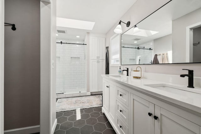 519 Glen Echo Dr, Old Hickory, TN 37138 - bathroom with a skylight, a stall shower, double vanity, tile patterned floors, and recessed lighting