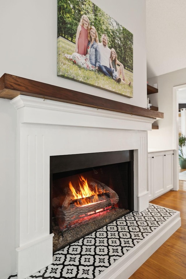 519 Glen Echo Dr, Old Hickory, TN 37138 - detailed view of a warm lit fireplace and wood finished floors