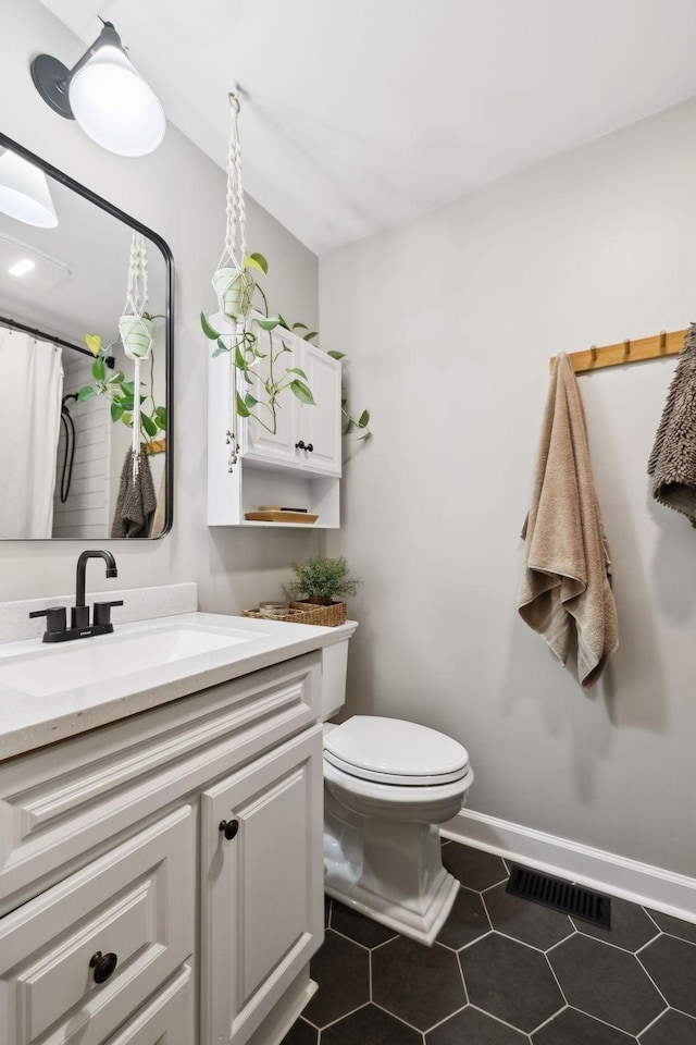 519 Glen Echo Dr, Old Hickory, TN 37138 - bathroom featuring vanity, toilet, baseboards, tile patterned flooring, and a shower with shower curtain