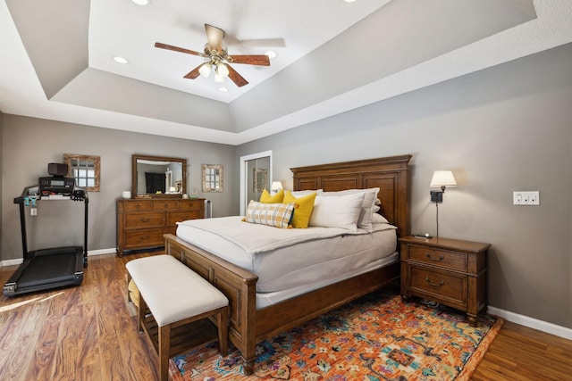 519 Glen Echo Dr, Old Hickory, TN 37138 - bedroom featuring baseboards, wood finished floors, a tray ceiling, recessed lighting, and ceiling fan