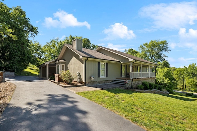 519 Glen Echo Dr, Old Hickory, TN 37138 - ranch-style home with a porch, a chimney, asphalt driveway, and a front yard