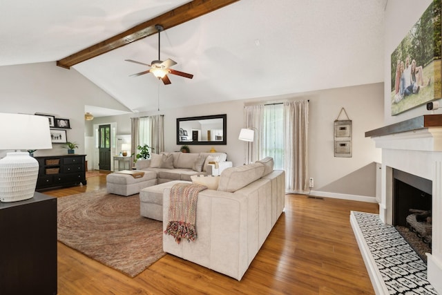 519 Glen Echo Dr, Old Hickory, TN 37138 - living room with ceiling fan, healthy amount of natural light, wood finished floors, beamed ceiling, and a fireplace