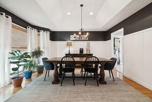 519 Glen Echo Dr, Old Hickory, TN 37138 - dining room with a decorative wall, a chandelier, wood finished floors, wainscoting, and a raised ceiling