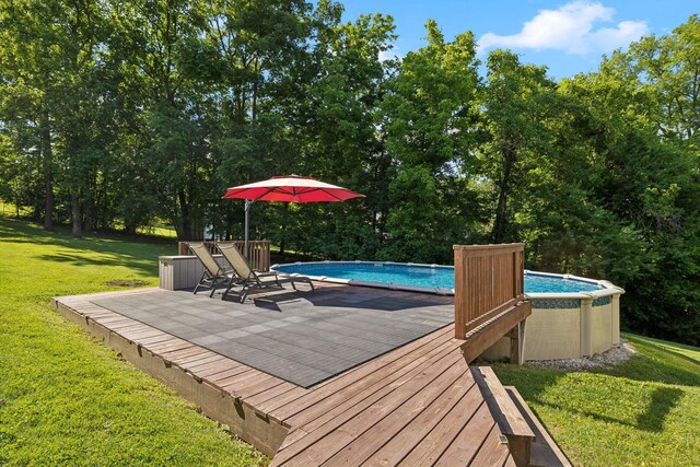 519 Glen Echo Dr, Old Hickory, TN 37138 - swimming pool with a lawn, a deck, and view of wooded area