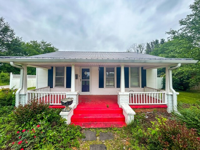 126 Carroll St S, Bruceton, TN 38317 - view of front of property with covered porch and metal roof