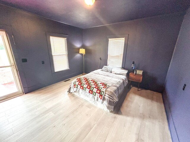 126 Carroll St S, Bruceton, TN 38317 - bedroom with wood finished floors and multiple windows