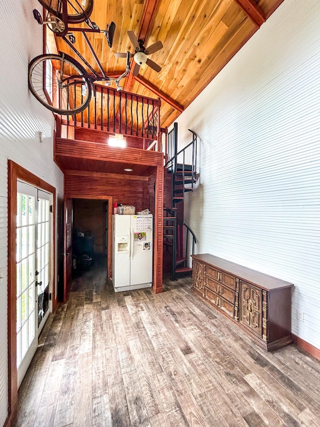 126 Carroll St S, Bruceton, TN 38317 - unfurnished living room with wooden ceiling, wood finished floors, a ceiling fan, stairs, and french doors