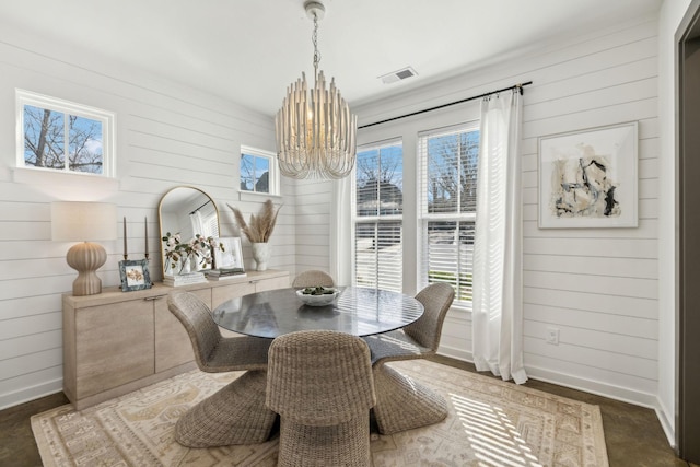 1609 Marsden Ave, Nashville, TN 37216 - dining area featuring a chandelier, baseboards, plenty of natural light, and wooden walls