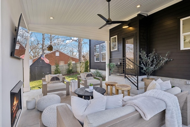 1609 Marsden Ave, Nashville, TN 37216 - view of patio / terrace with an outdoor living space with a fireplace and ceiling fan