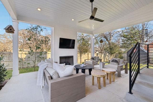1609 Marsden Ave, Nashville, TN 37216 - fenced backyard with an outdoor living space with a fireplace, a patio area, and ceiling fan