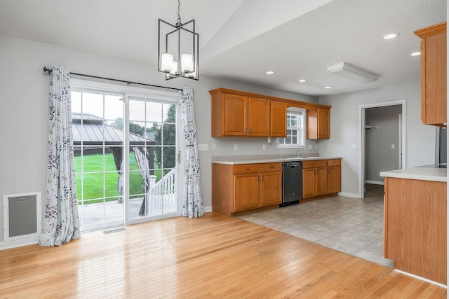 3408 Wj Robinson Rd, Cookeville, TN 38506 - kitchen with light countertops, dishwasher, a chandelier, light wood-style flooring, and pendant lighting