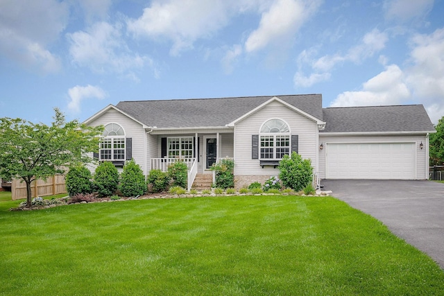 3408 Wj Robinson Rd, Cookeville, TN 38506 - single story home featuring asphalt driveway, covered porch, an attached garage, and a shingled roof