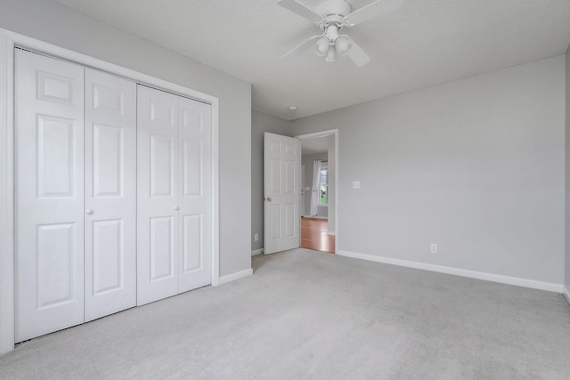 3408 Wj Robinson Rd, Cookeville, TN 38506 - unfurnished bedroom with carpet flooring, baseboards, a closet, and a ceiling fan