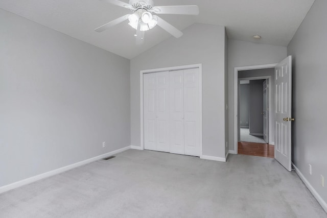 3408 Wj Robinson Rd, Cookeville, TN 38506 - unfurnished bedroom with light carpet, baseboards, a closet, vaulted ceiling, and ceiling fan