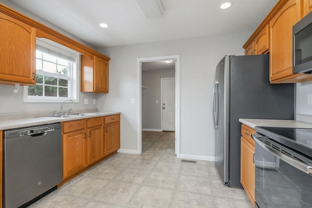3408 Wj Robinson Rd, Cookeville, TN 38506 - kitchen featuring stainless steel dishwasher, a sink, black electric range, light countertops, and baseboards