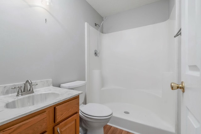 3408 Wj Robinson Rd, Cookeville, TN 38506 - bathroom with a shower, toilet, vanity, and wood finished floors
