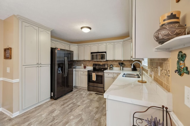3323 Troy Rd, Lebanon, TN 37087 - kitchen with appliances with stainless steel finishes, a sink, decorative backsplash, and light stone countertops