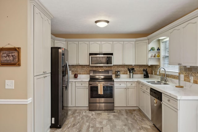 3323 Troy Rd, Lebanon, TN 37087 - kitchen with appliances with stainless steel finishes, a sink, tasteful backsplash, open shelves, and light countertops