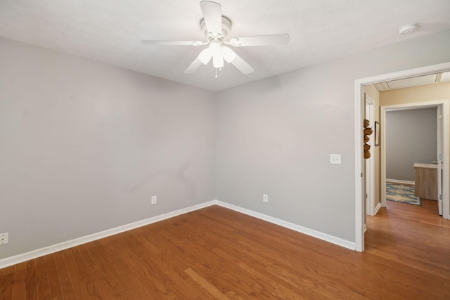 3323 Troy Rd, Lebanon, TN 37087 - spare room featuring attic access, wood finished floors, baseboards, and a ceiling fan