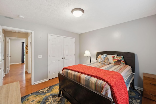 3323 Troy Rd, Lebanon, TN 37087 - bedroom with wood finished floors, a closet, and baseboards