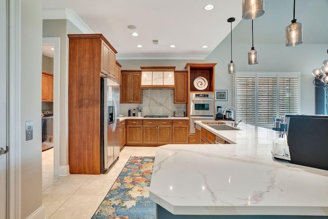 1161 Chloe Dr, Gallatin, TN 37066 - kitchen with appliances with stainless steel finishes, a sink, brown cabinetry, backsplash, and light stone counters