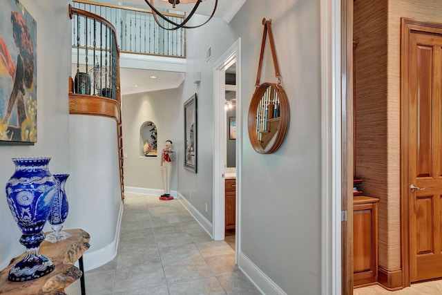 1161 Chloe Dr, Gallatin, TN 37066 - hallway featuring baseboards, a chandelier, crown molding, and light tile patterned floors