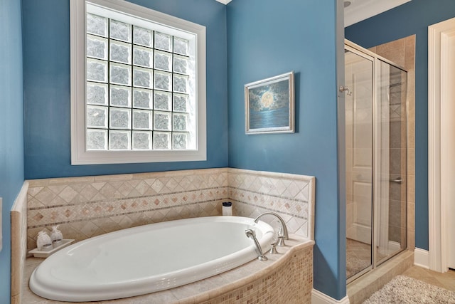 1161 Chloe Dr, Gallatin, TN 37066 - bathroom featuring healthy amount of natural light, a stall shower, a bath, and tile patterned floors