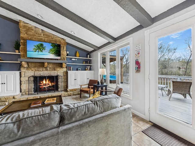 695 Bayshore Dr, Cadiz, KY 42211 - living area featuring light tile patterned flooring, a fireplace, a textured ceiling, built in features, and baseboards