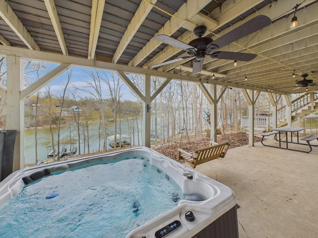 695 Bayshore Dr, Cadiz, KY 42211 - view of patio with ceiling fan, a hot tub, a water view, and stairs