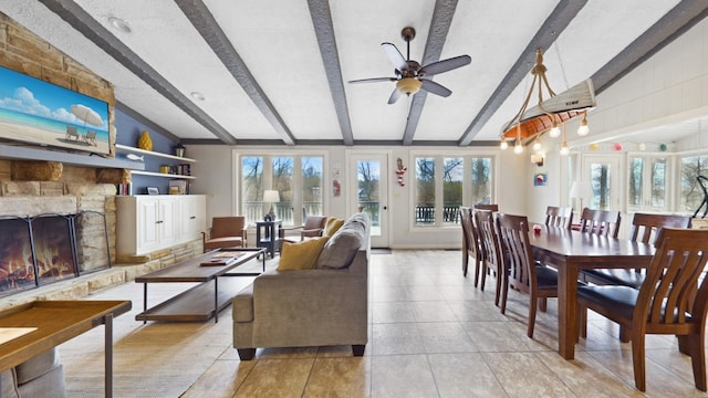 695 Bayshore Dr, Cadiz, KY 42211 - living area with plenty of natural light, a stone fireplace, ceiling fan, and tile patterned floors