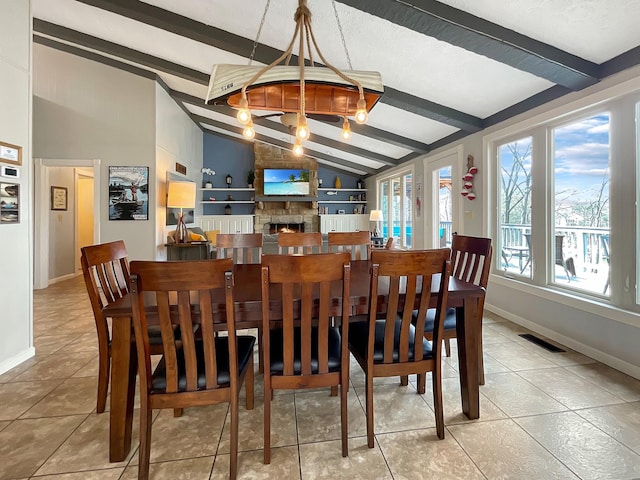 695 Bayshore Dr, Cadiz, KY 42211 - tiled dining area featuring baseboards, a fireplace, and a chandelier