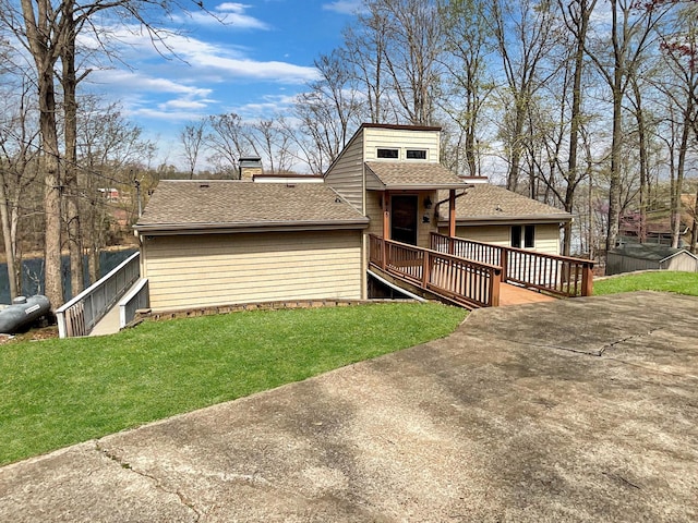 695 Bayshore Dr, Cadiz, KY 42211 - back of property with a yard, a shingled roof, a deck, and a chimney