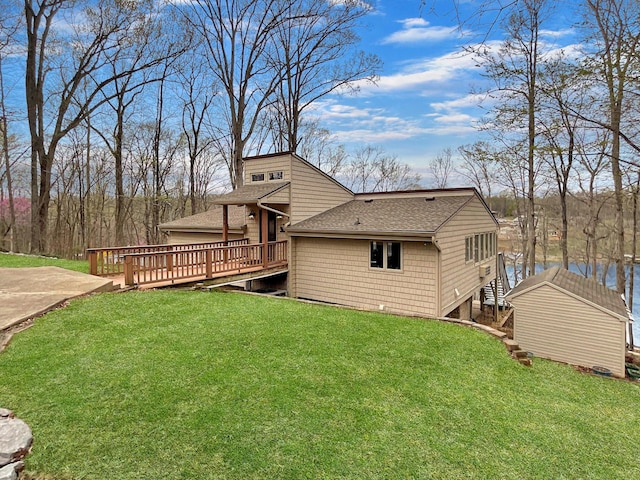 695 Bayshore Dr, Cadiz, KY 42211 - back of house with roof with shingles, a deck with water view, a yard, and stairway