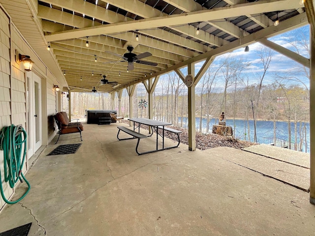 695 Bayshore Dr, Cadiz, KY 42211 - view of patio / terrace featuring a hot tub, a water view, and ceiling fan