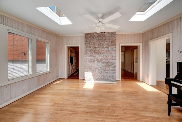 213 Andover Way, Nashville, TN 37221 - unfurnished room with a skylight, crown molding, light wood-type flooring, baseboards, and ceiling fan