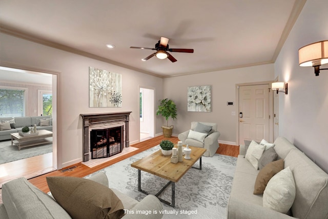 213 Andover Way, Nashville, TN 37221 - living area with a ceiling fan, crown molding, light wood finished floors, a fireplace with flush hearth, and baseboards