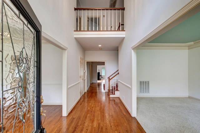 213 Andover Way, Nashville, TN 37221 - entrance foyer with stairs, a towering ceiling, wood finished floors, and baseboards