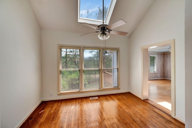 213 Andover Way, Nashville, TN 37221 - empty room with wood finished floors, baseboards, ceiling fan, and high vaulted ceiling