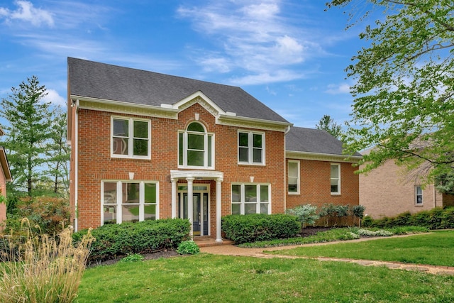 213 Andover Way, Nashville, TN 37221 - colonial house with a front lawn, brick siding, and a shingled roof