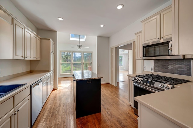 213 Andover Way, Nashville, TN 37221 - kitchen featuring appliances with stainless steel finishes, cream cabinets, light wood-style flooring, recessed lighting, and tasteful backsplash