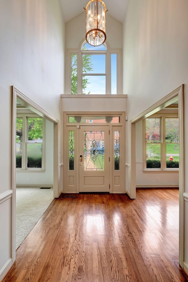 213 Andover Way, Nashville, TN 37221 - entrance foyer featuring high vaulted ceiling, a chandelier, and wood finished floors