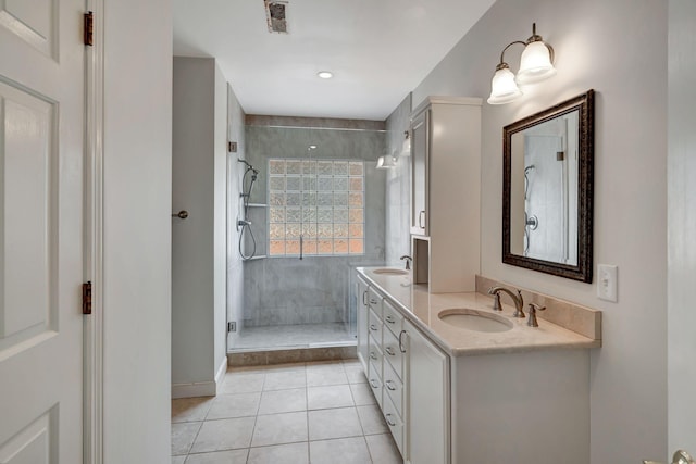 213 Andover Way, Nashville, TN 37221 - bathroom featuring tiled shower, tile patterned floors, double vanity, and baseboards