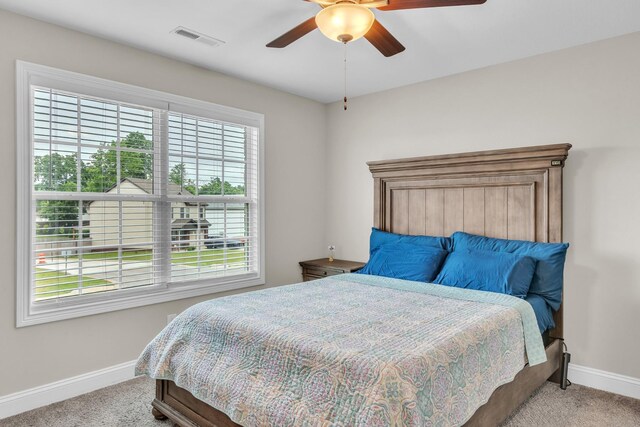 1928 Sydney Louise Dr, Clarksville, TN 37042 - bedroom featuring light carpet, baseboards, and a ceiling fan