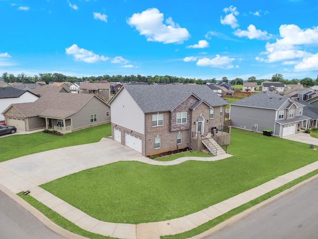 1928 Sydney Louise Dr, Clarksville, TN 37042 - traditional-style home featuring a residential view, an attached garage, driveway, brick siding, and a front lawn