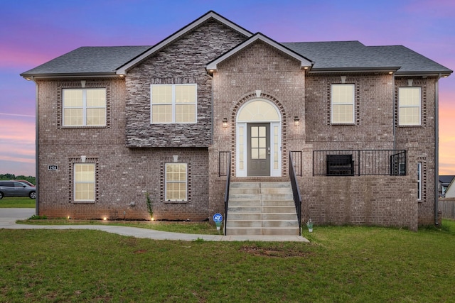 1928 Sydney Louise Dr, Clarksville, TN 37042 - view of front of house with brick siding, a front lawn, and a shingled roof