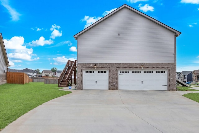 1928 Sydney Louise Dr, Clarksville, TN 37042 - view of home's exterior with stairs, driveway, brick siding, and a garage