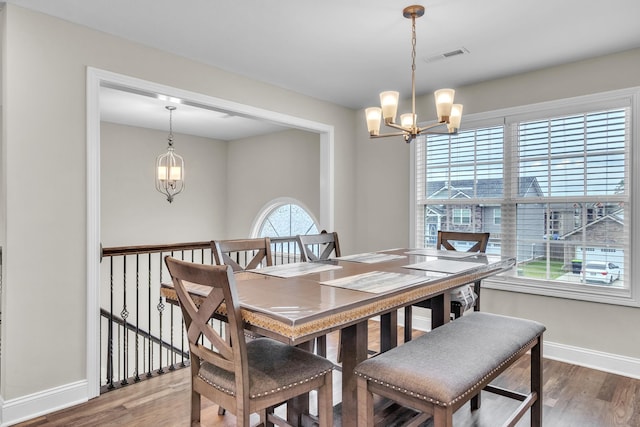 1928 Sydney Louise Dr, Clarksville, TN 37042 - dining area with a chandelier, wood finished floors, and baseboards