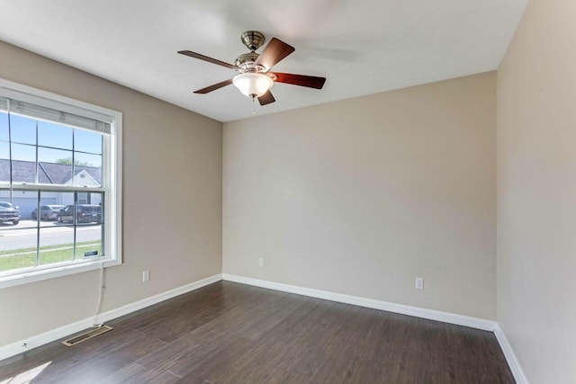 991 Wing Tip Cir, Hopkinsville, KY 42240 - spare room featuring dark wood-type flooring, a ceiling fan, and baseboards