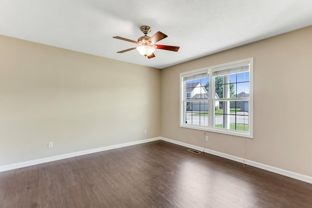991 Wing Tip Cir, Hopkinsville, KY 42240 - spare room featuring baseboards, dark wood finished floors, and a ceiling fan