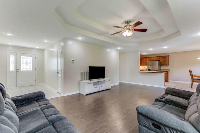 991 Wing Tip Cir, Hopkinsville, KY 42240 - living area with a ceiling fan, light wood-style floors, a raised ceiling, recessed lighting, and baseboards